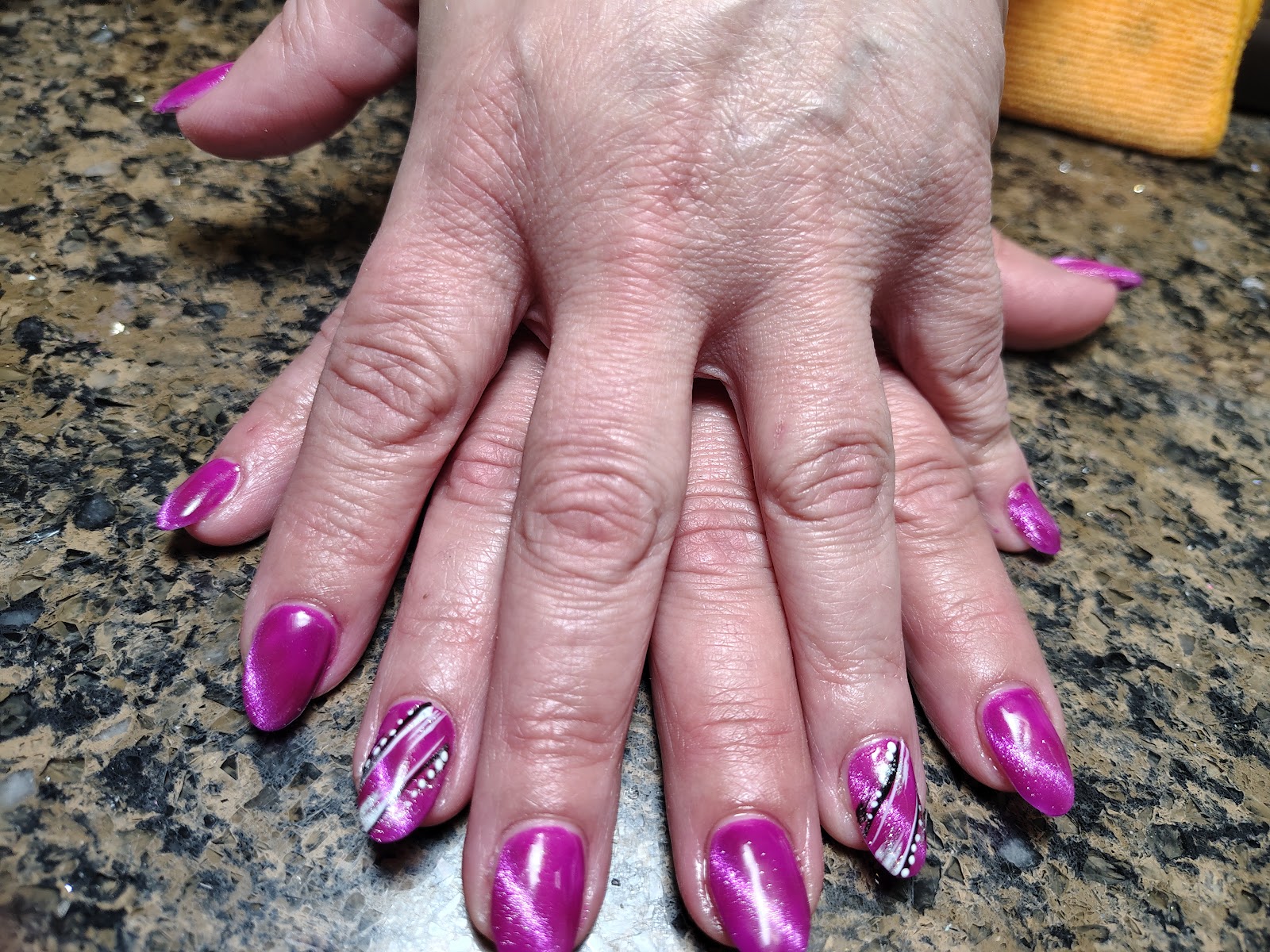 Fuchsia shimmer nails with a single silver-striped accent nail